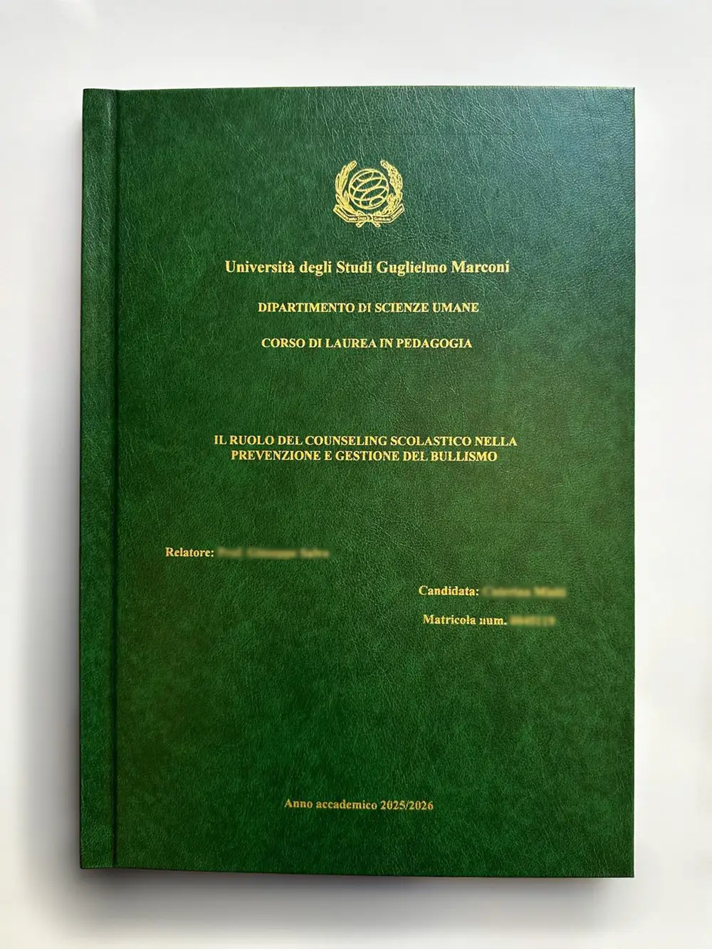 Guglielmo Marconi University thesis bound by GUUG: green hardcover with gold foil, Pedagogy degree